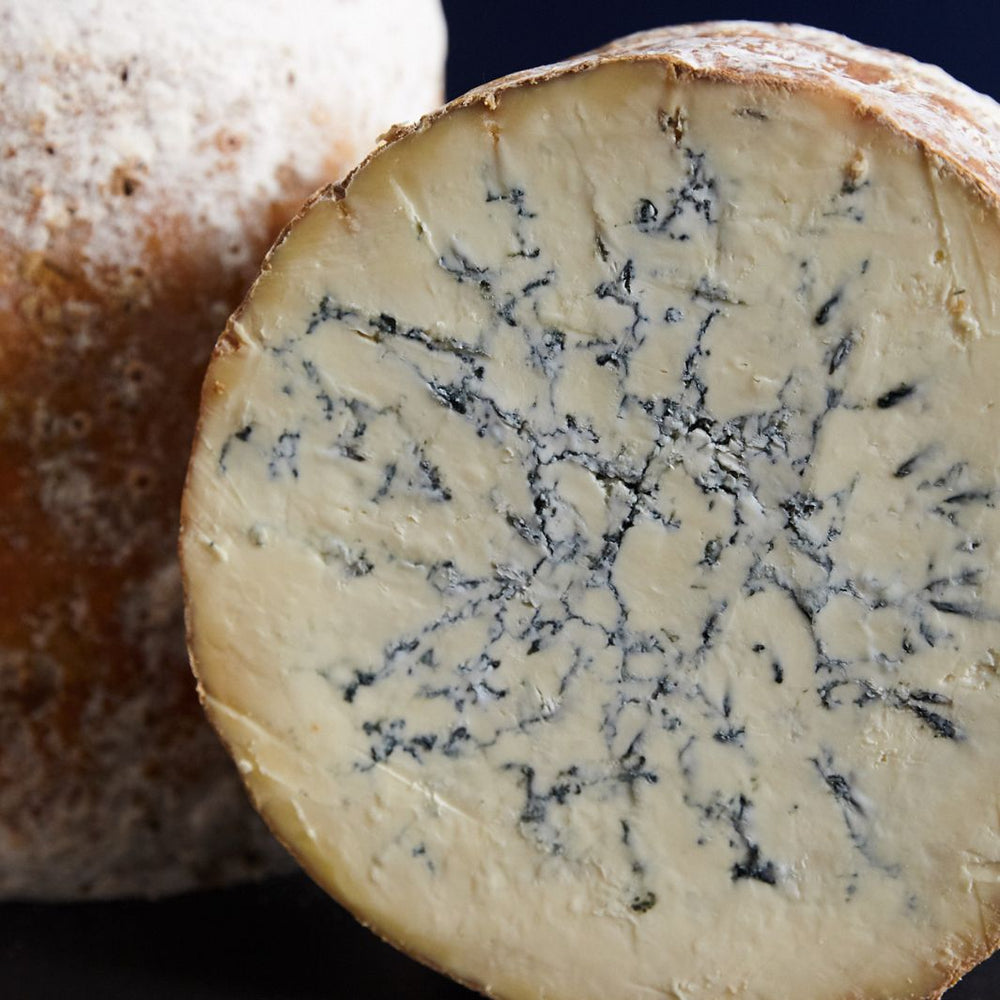 Colston Bassett Stilton cheese showing creamy paste and delicate blue veining