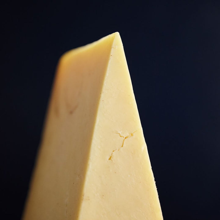 Close up of Montgomery’s Cheddar cheese with firm but friable paste